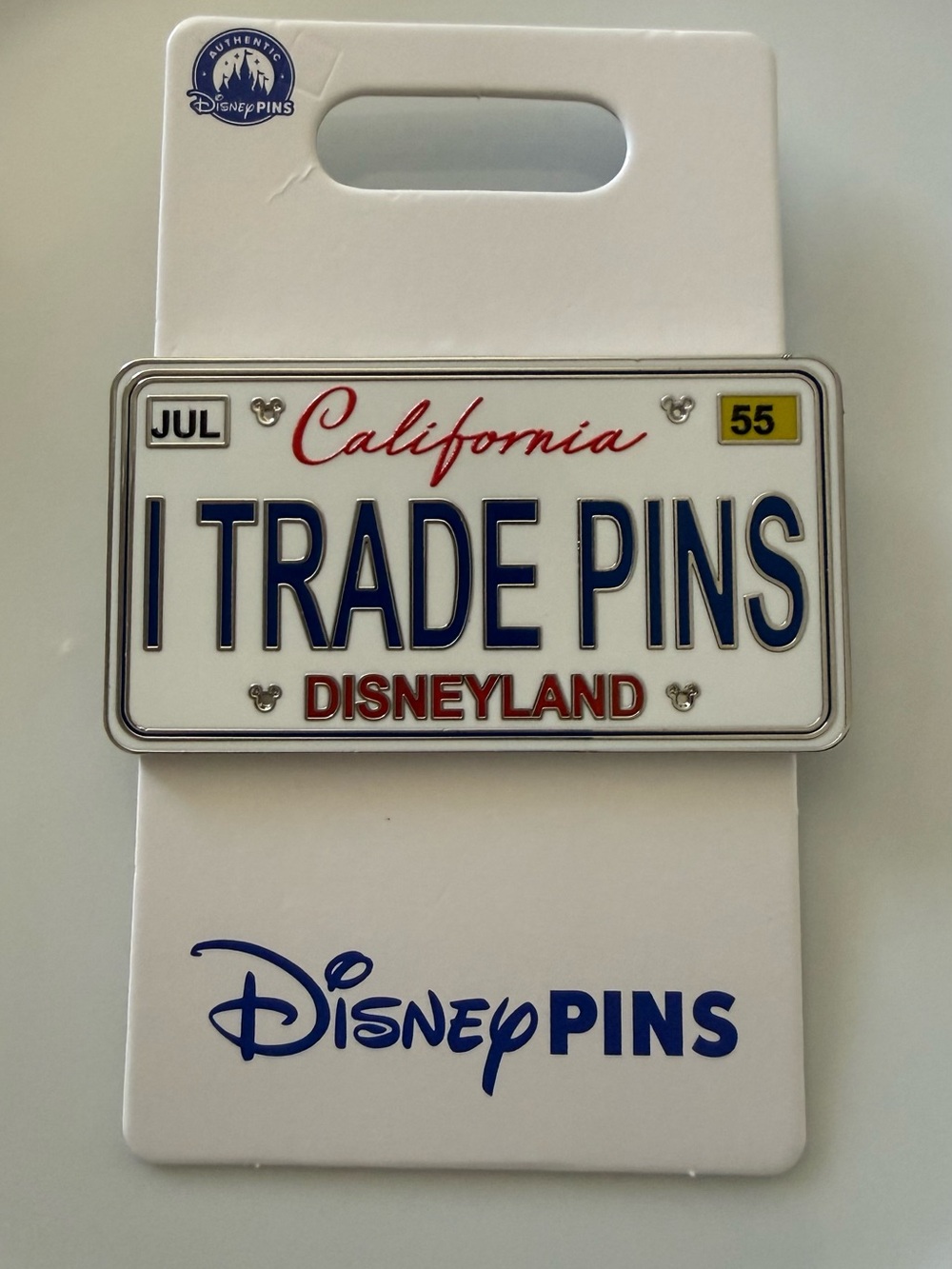 Disneyland White, Blue & Red "I Trade Pins" License Plate Pin